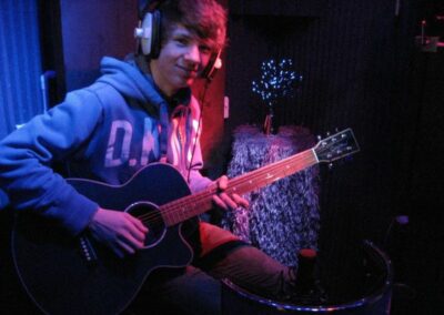 Guitar player in recording studio